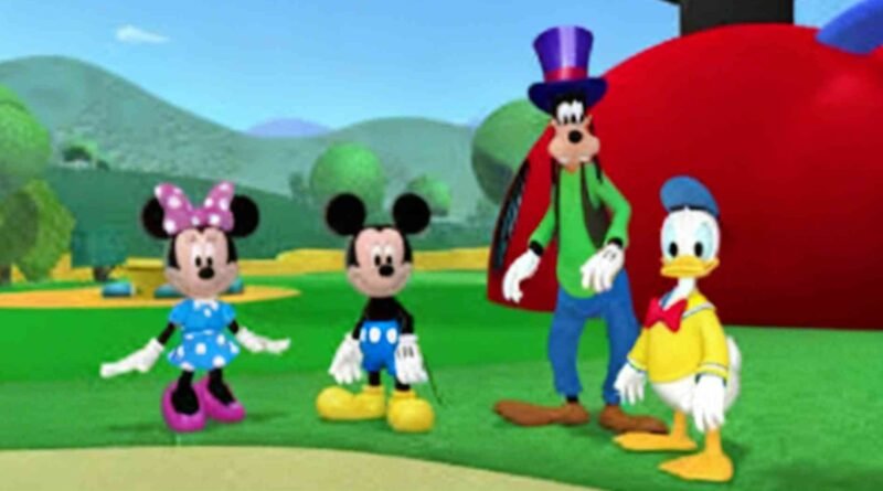 A 3D animated scene from Mickey Mouse Clubhouse showing the main characters on a green hill in front of the iconic red clubhouse. The show aired from 2006 to 2016 and was broadcast across Latin America including on Spanish-language platforms from 2014 to 2018.